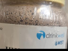 HIX-Nano media beads in a Drinkwell sample jar.